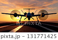 Low angle view of a twin-engine surveillance drone with spinning propellers on flight deck runway at sunset, ready for mission 131771425