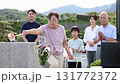 Senior woman cleaning the grave 131772372