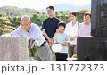 Senior man cleaning the grave 131772373
