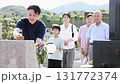 Man cleaning the grave 131772374