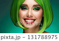 Portrait of stunning woman with vibrant green hair posing confidently for camera with natural joyful smile 131788975
