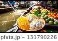 Delicious mango sticky rice on boat at traditional floating market with vendors selling fruits 131790226