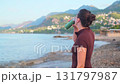 Outdoor fitness morning workout on beach hydration and energy promoting healthy active lifestyle 131797987
