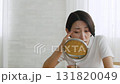 Middle-aged woman checking her skin condition in the mirror 131820049