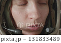 woman astronaut speaking on helmet microphones 131833489