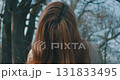 woman with brown hair in nature 131833495