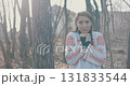 worried woman in forest 131833544