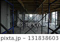 Metal scaffolding structures inside unfinished building at construction site 131838603