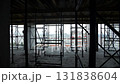 Construction scaffolding inside unfinished concrete building structure 131838604