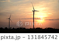 Video of wind power station of giant windmills in works under red sky at sunset 131845742