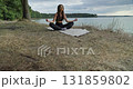 Meditation by the peaceful Lakeside Embracing Calm and Serenity in Natures Beauty 131859802