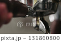 Slow motion inserting single spout portafilter into coffee machine 131860800