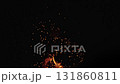 Slow motion of sparks and embers from campfire flying over black background 131860811