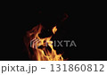 Slow motion shot of fire flames of campfire over black background, for overlay 131860812