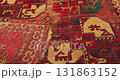 Close up shot of an old shabby handmade carpet made by Samarkand masters using ancient technology. It is covered with national patterns and ornaments. Uzbekistan. 131863152