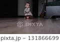Baby Sitting on Floor with Yellow Ball 131866699