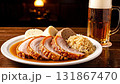 Traditional Czech roast pork with dumplings sauerkraut and a large mug of cold beer in a pub 131867470