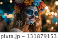 Man dressed for Dia de Muertos celebration in Mexico during sunset with elaborate calavera makeup 131879153