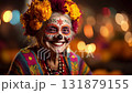 Man dressed for Dia de Muertos celebration in Mexico during sunset with elaborate calavera makeup 131879155