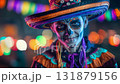 Man dressed for Dia de Muertos celebration in Mexico during sunset with elaborate calavera makeup 131879156