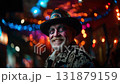 Man dressed for Dia de Muertos celebration in Mexico during sunset with elaborate calavera makeup 131879159