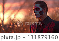 Man dressed for Dia de Muertos celebration in Mexico during sunset with elaborate calavera makeup 131879160