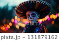 Man dressed for Dia de Muertos celebration in Mexico during sunset with elaborate calavera makeup 131879162