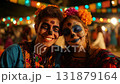 Man dressed for Dia de Muertos celebration in Mexico during sunset with elaborate calavera makeup 131879164