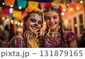 Man dressed for Dia de Muertos celebration in Mexico during sunset with elaborate calavera makeup 131879165