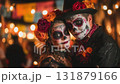 Man dressed for Dia de Muertos celebration in Mexico during sunset with elaborate calavera makeup 131879166
