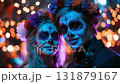 Man dressed for Dia de Muertos celebration in Mexico during sunset with elaborate calavera makeup 131879167