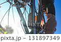Low-angle view of cyclist pedaling road bike on sunny day 131897349