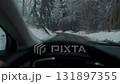 Winter forest road view from car interior 131897355