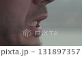 Close-up of a man mouth talking and moving lips 131897357