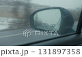 View of foggy highway reflecting in side rear view car mirror 131897358
