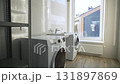 Laundry room filled with modern washing and drying machines 131897869