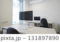 Office filled with computers and desks shines with precision 131897890