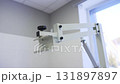 Metal tripod forms base for veterinary X-ray equipment 131897897