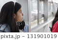 Teen Girl Turning Toward Camera at Platform 131901019