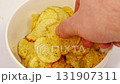 rotation. potato chips with spices in a bowl.  131907311