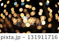 Glowing Golden Garland Creates An Abstract And Blurred Christmas Bokeh Background 131911716