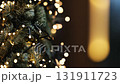 Decorated Christmas Tree Stands Outdoors Against A Blurred Holiday Abstract Bokeh Background 131911723