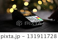 Woman Paying With An Nfc Credit Card On A Wireless Terminal And Entering A Pin Code 131911728