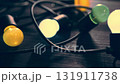 Colorful Garland Bulbs On A Table, A Pleasant Atmosphere In A Cozy Room 131911738