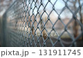 Chain-Link Fence Covered In Morning Frost Symbolizes The Concept Of Land Parcel Protection 131911745