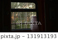 A view out the window of a moving train compartment against the backdrop of a forest and evening sunset. Train travel concept 131913193
