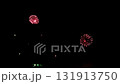 Series of exploding fireworks filling the dark night sky during a pyrotechnic display depicting a festive event 131913750