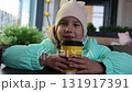 Little girls drinking cocoa in a cafe 131917391
