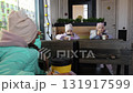 Little girls drinking cocoa in a cafe 131917599