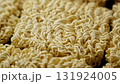 Uncooked instant noodles rotating. Large quantity of instant ramen noodles 131924005